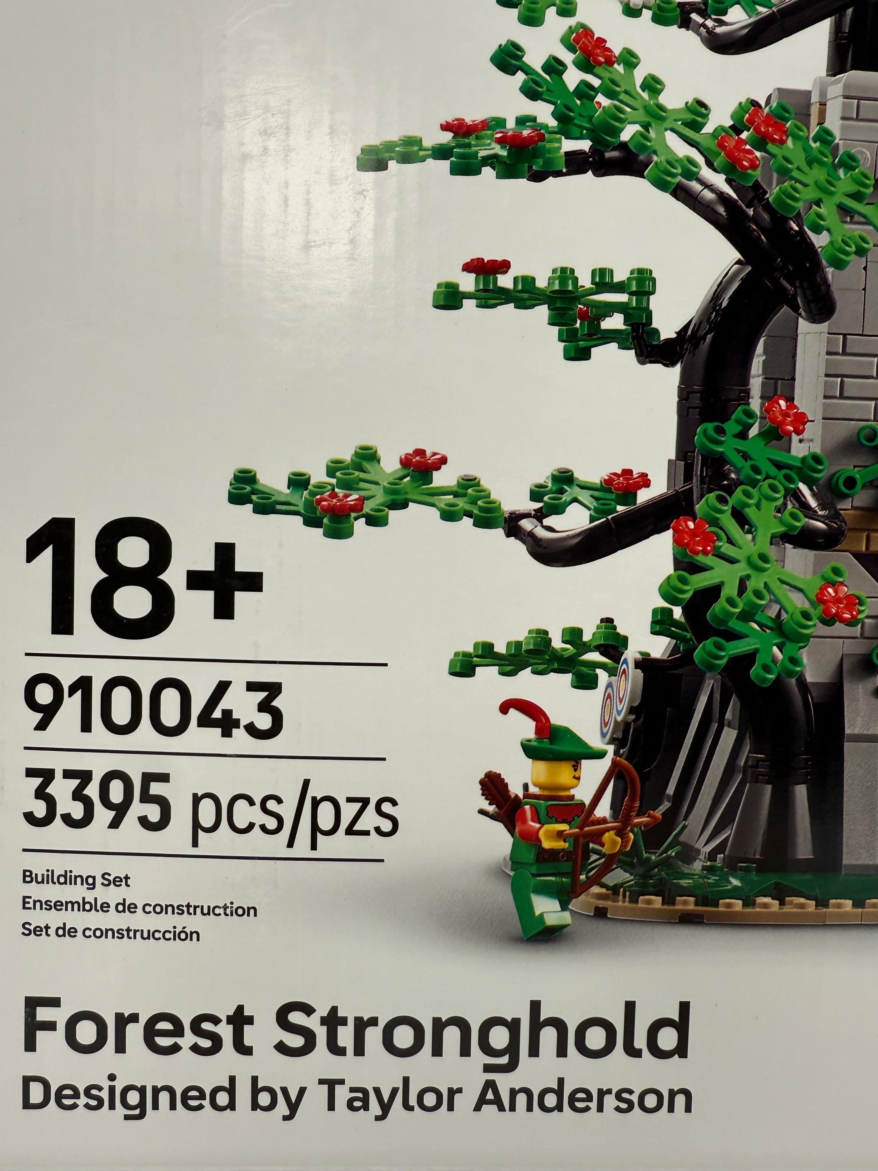 Legacy Brick LEGO Forest Stronghold 910043 set box featuring a forest minifigure and detailed tree build.